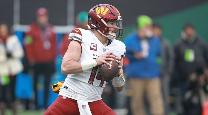 Sam Howell holds the ball in the pocket